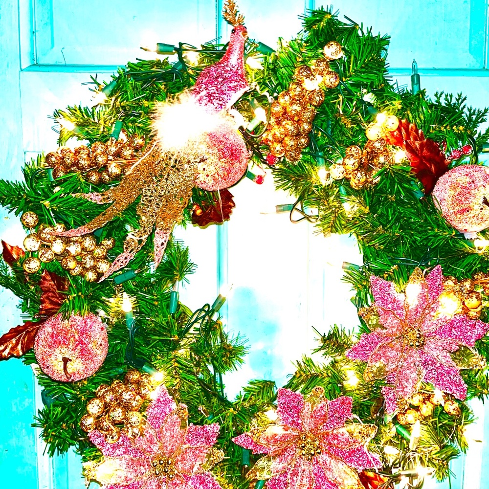 Pink poinsettia, peacock wreath